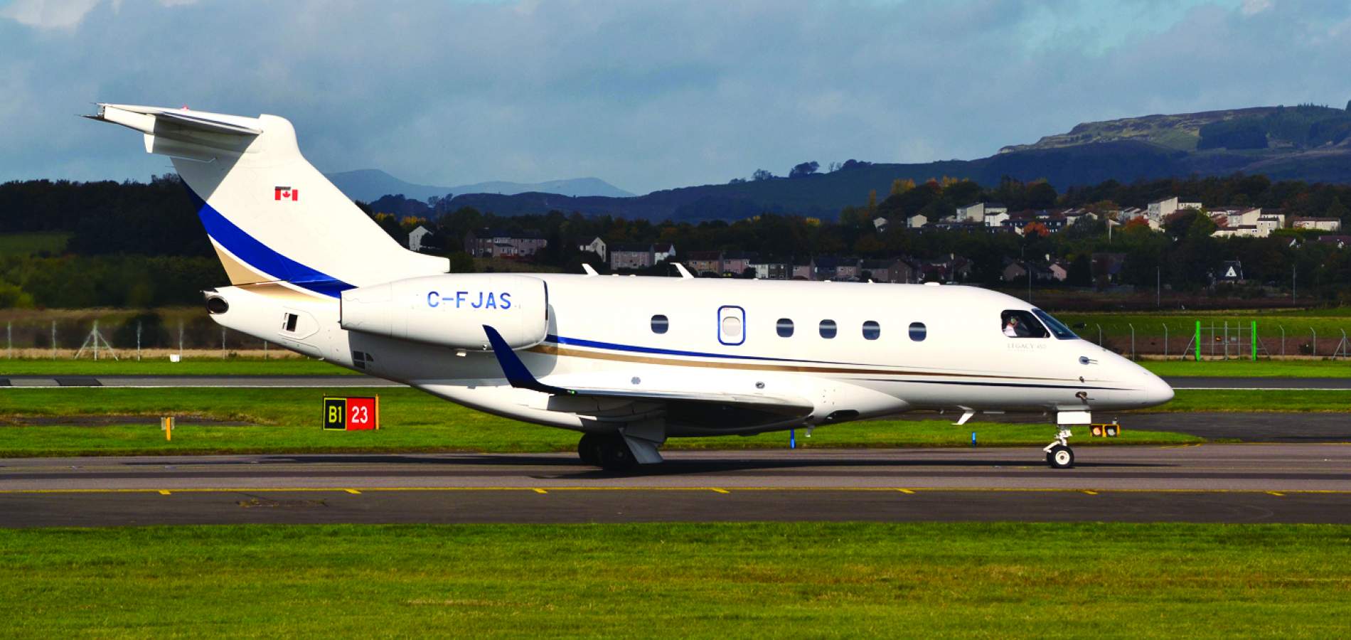 AirSprint Legacy 450 side view runway