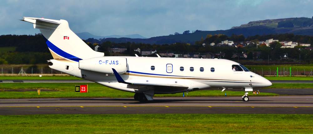 AirSprint Legacy 450 side view runway